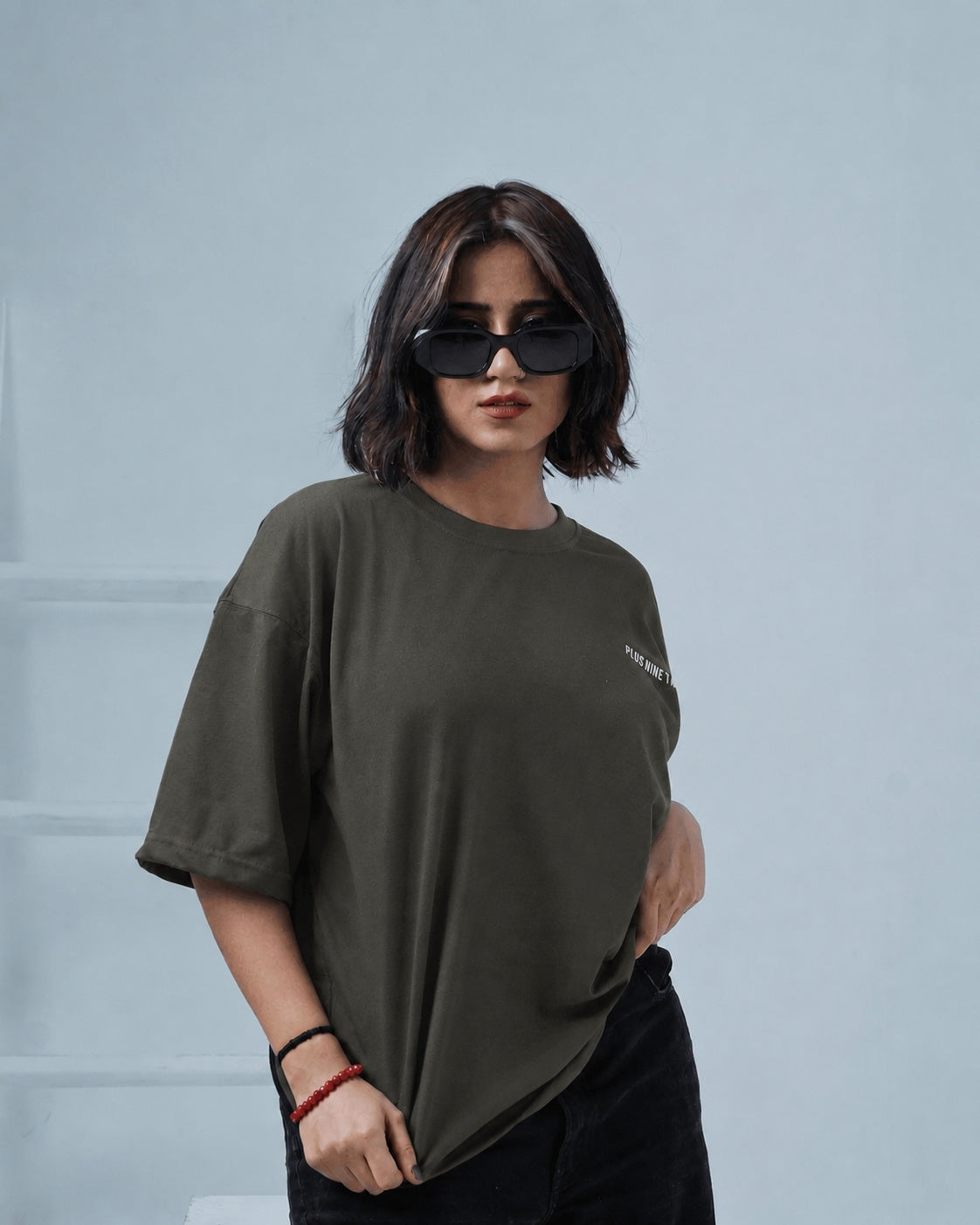 Women posing wearing essentials army green oversized t-shirt by Plus92 Clothing