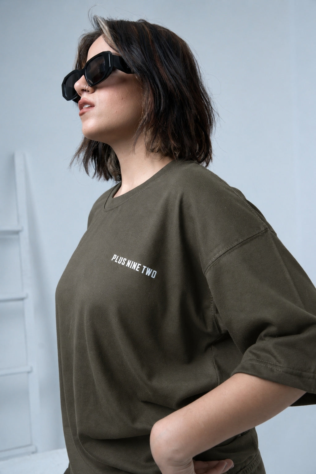 Women wearing Army Green Oversized T-Shirt by Plus92 Clothing