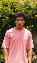 Men’s Baby Pink Essentials Dropshirt front view in garden photoshoot
