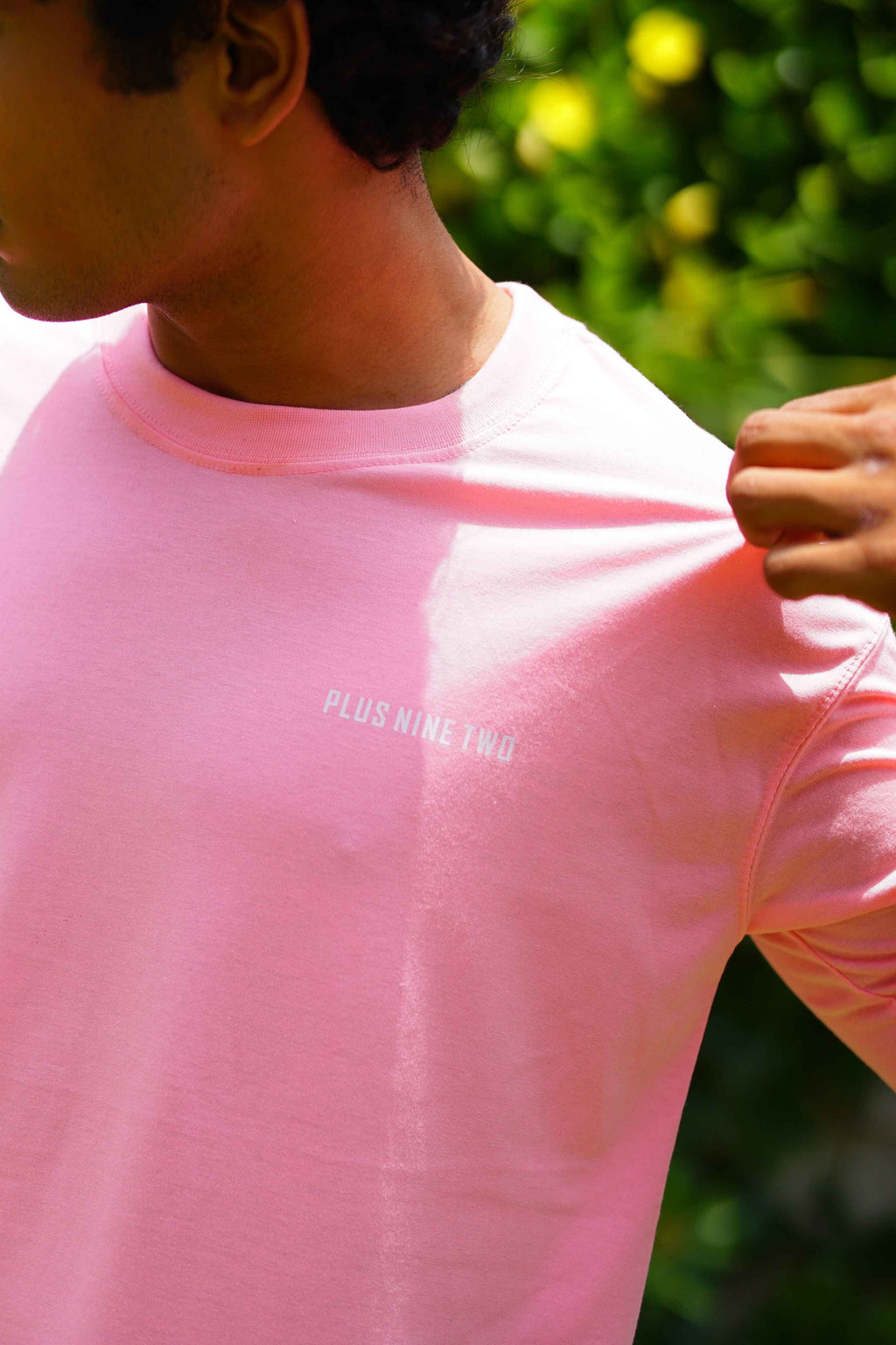 Close-up of Men’s Baby Pink Essentials Dropshirt chest logo