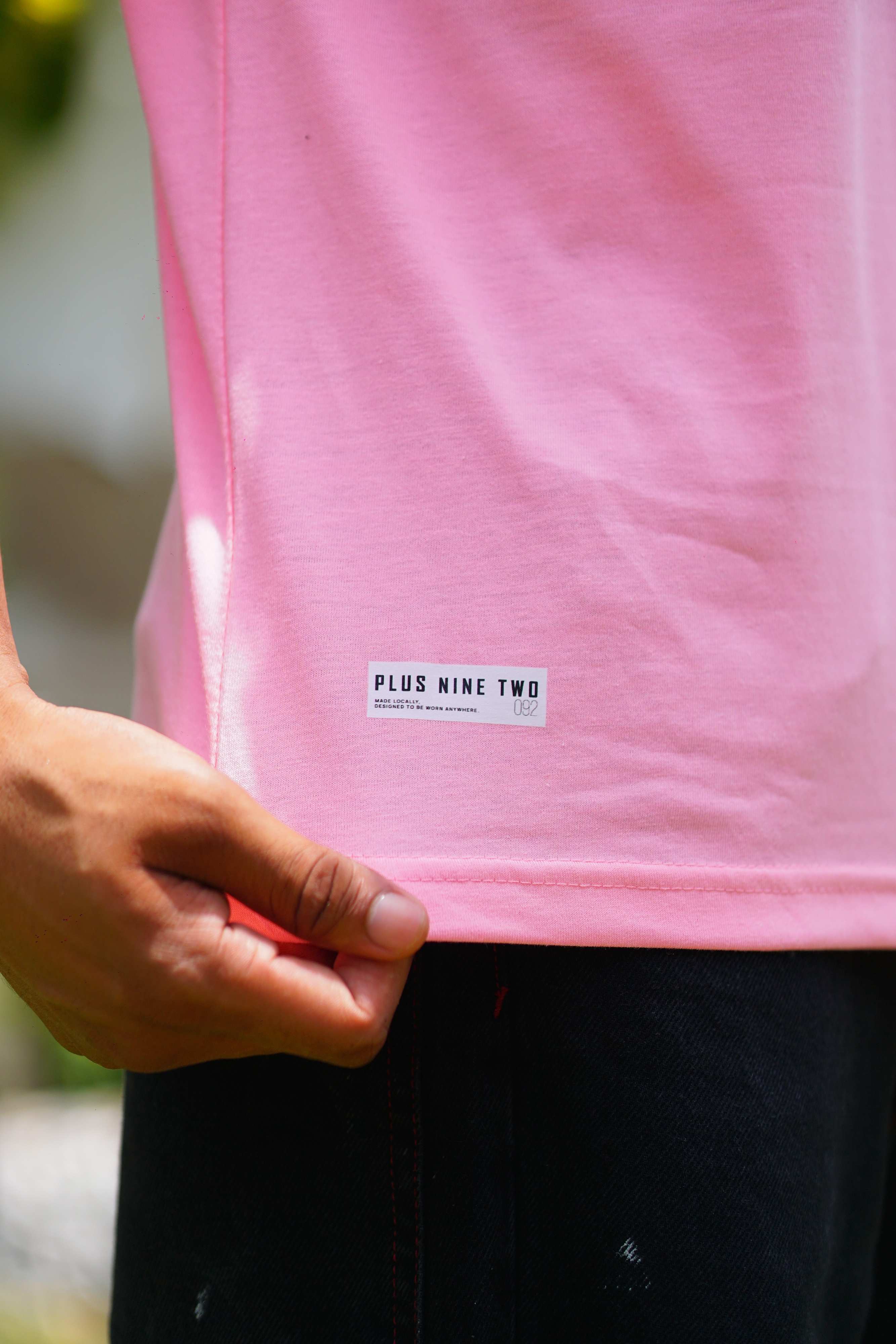 Close-up of Men’s Baby Pink Essentials Dropshirt hem label