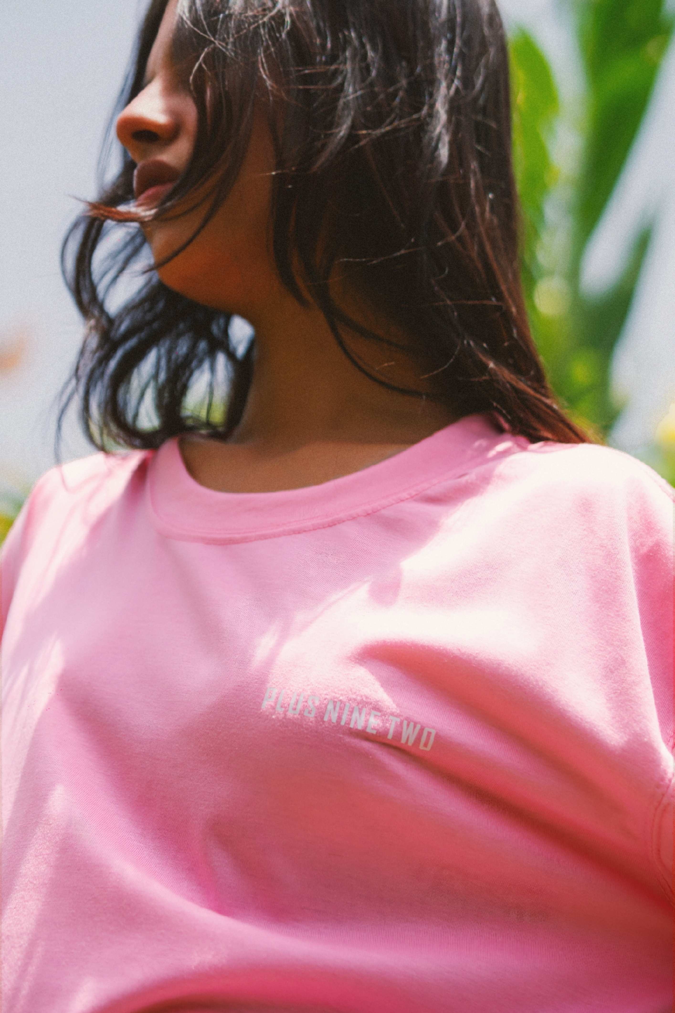 Close-up of Women’s Baby Pink Essentials Dropshirt neckline and logo