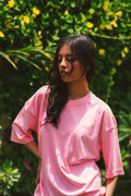 Women’s Baby Pink Essentials Dropshirt styled in garden lifestyle photo