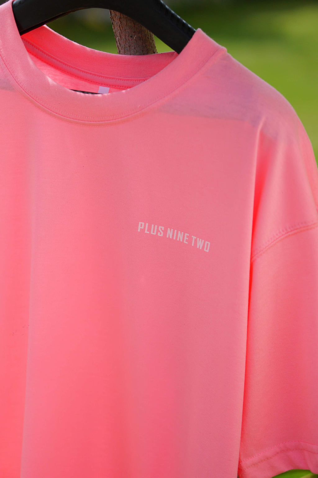Baby Pink Essentials Dropshirt close-up with Plus Nine Two chest logo