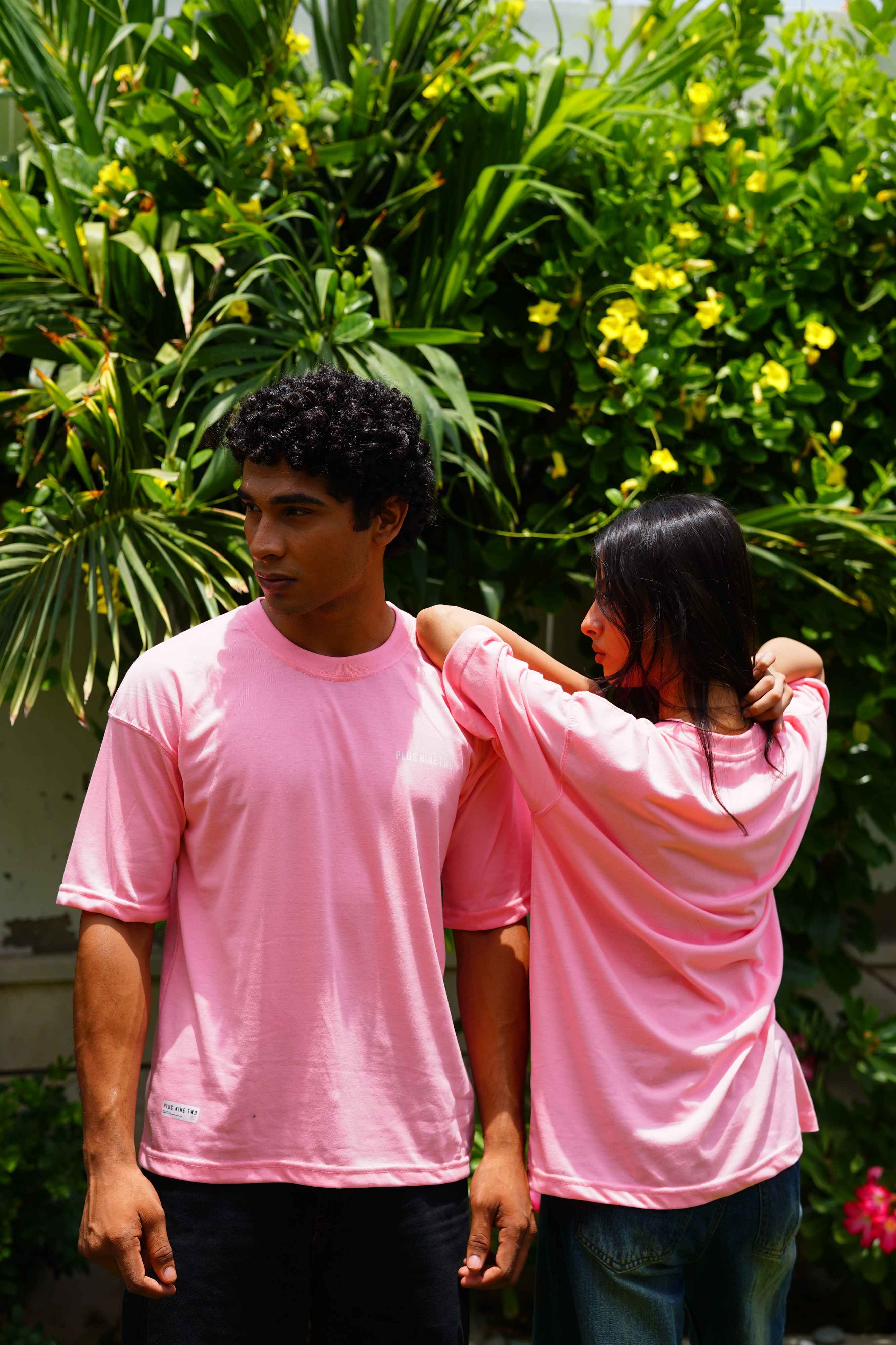 Male and female models wearing Baby Pink Essentials Dropshirts by +92 Clothing