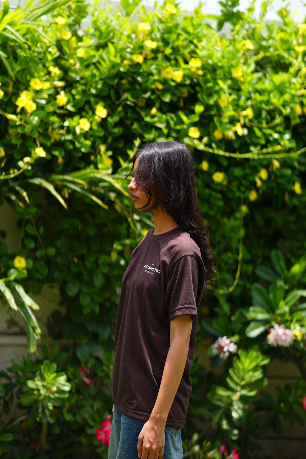 Side view of Women’s Karak Brown Essentials Blend T-Shirt outdoors