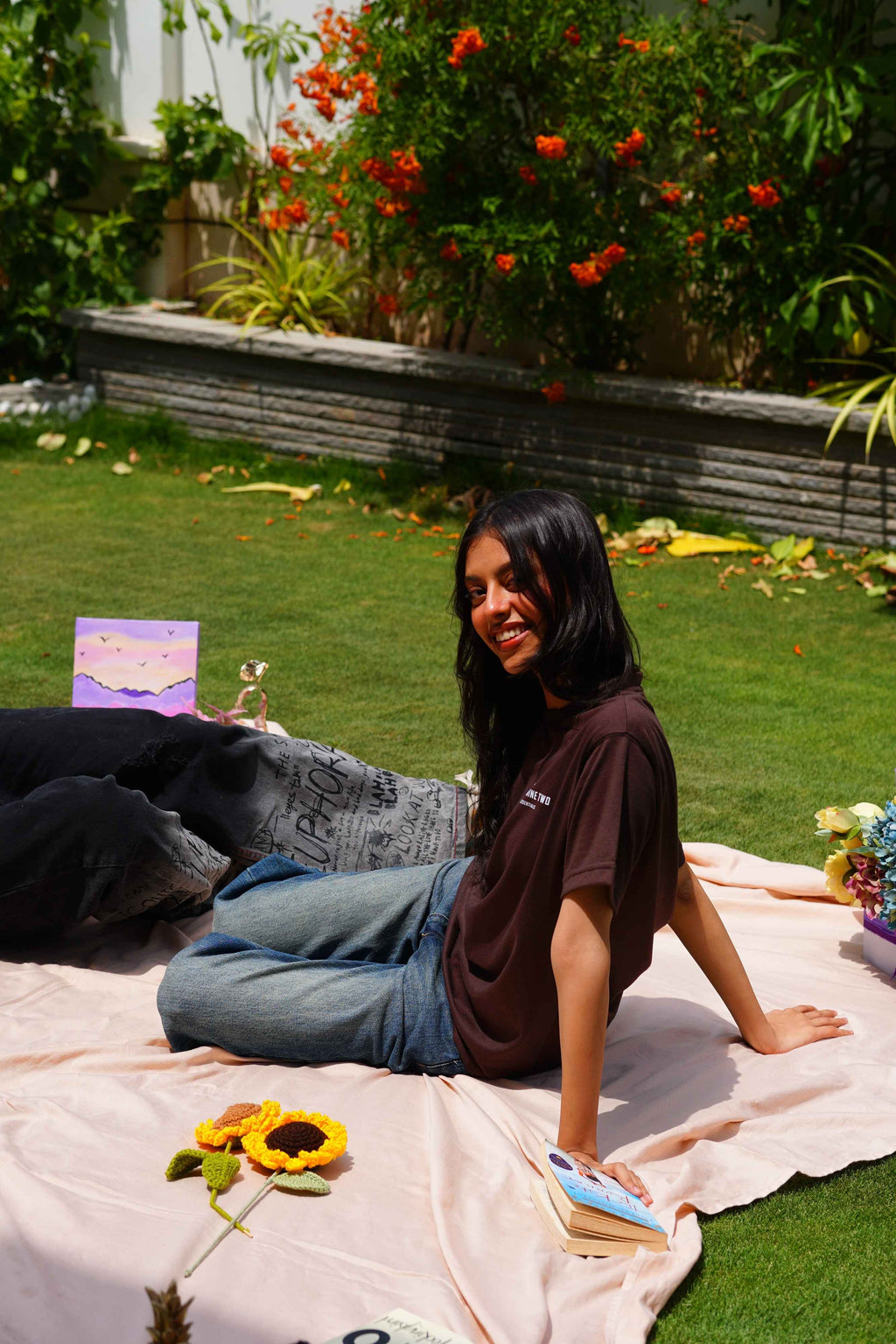 Women’s Karak Brown Blend T-Shirt seated outdoor lifestyle photo