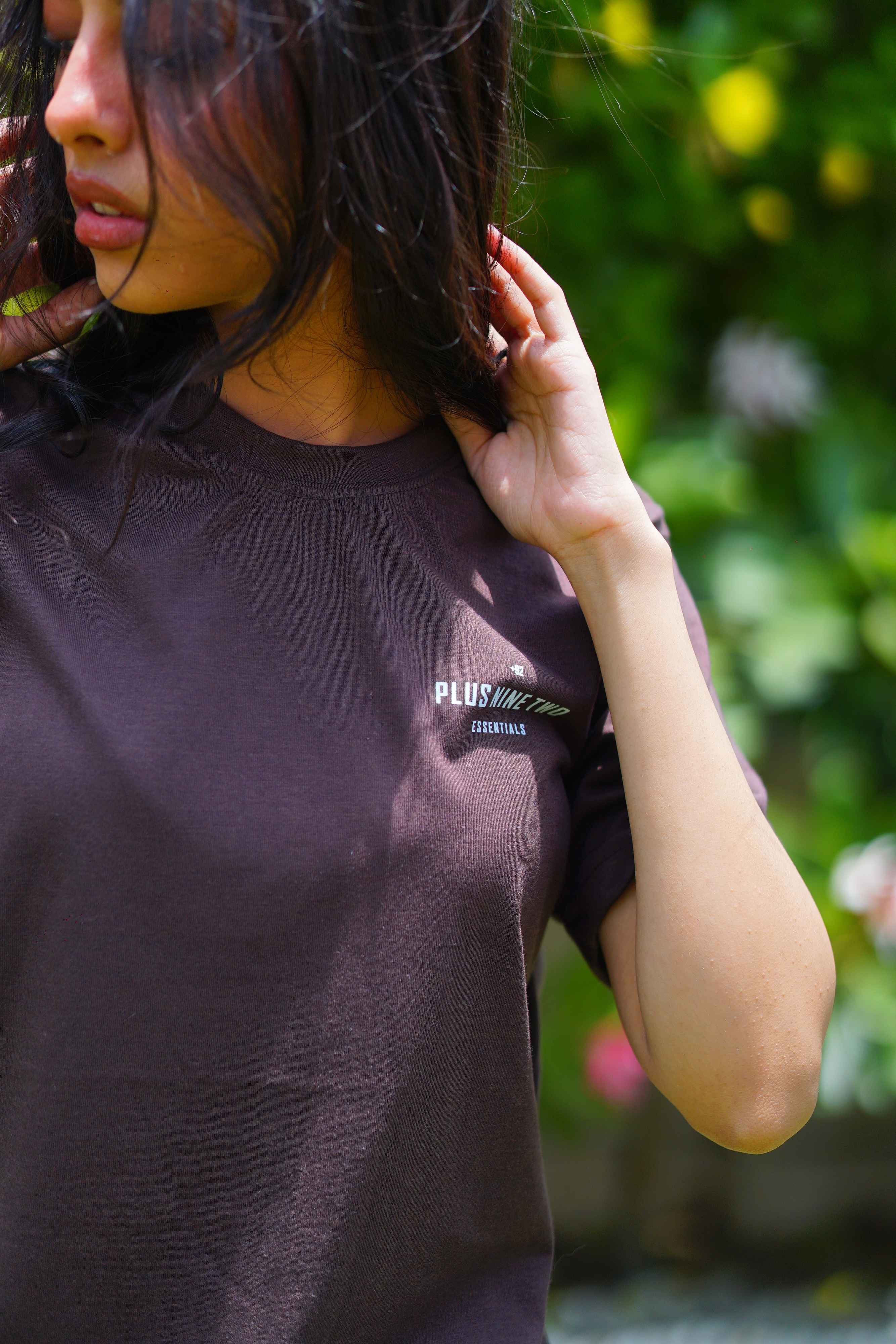 Close-up of Women’s Karak Brown Essentials Blend T-Shirt with +92 logo