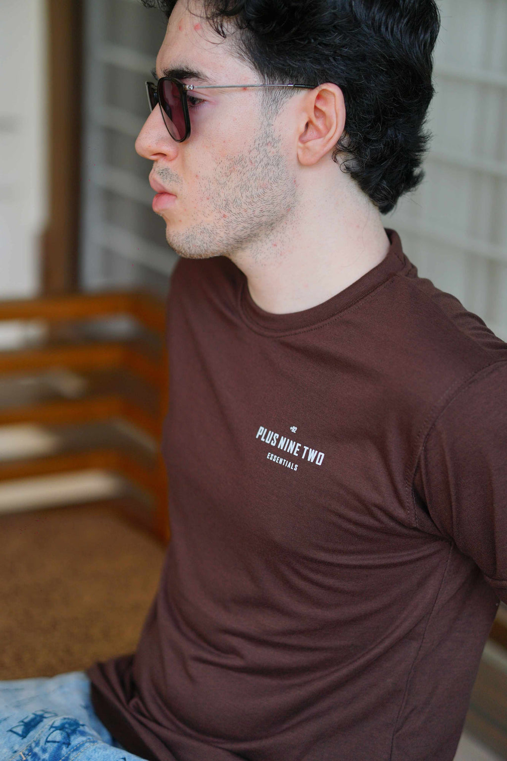 Close-up of Men’s Karak Brown Blend T-Shirt fabric and +92 logo