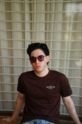Men’s Karak Brown Essentials Blend T-Shirt seated front view with +92 logo