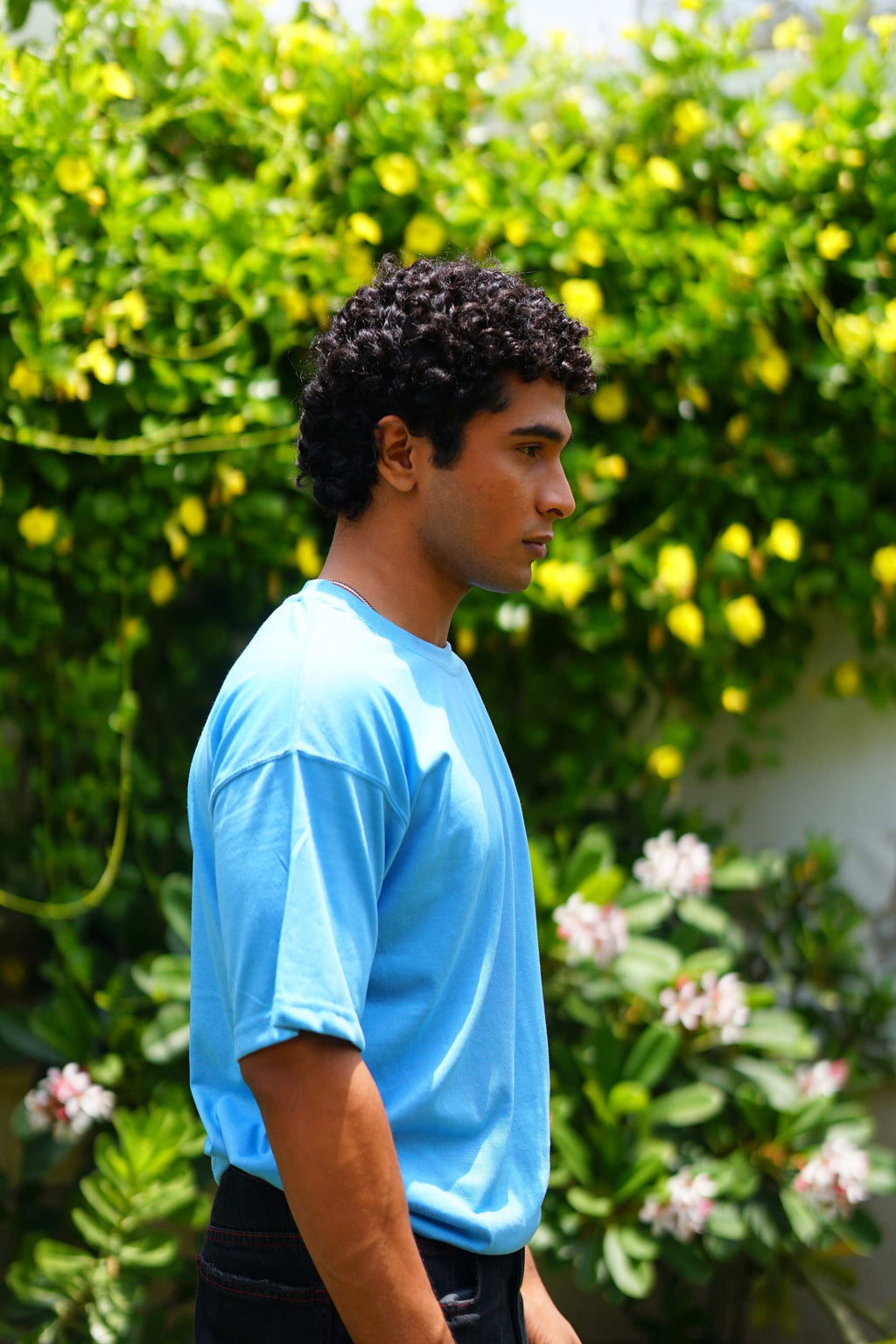 Side profile of male model wearing K2 Cloud sky blue oversized dropshirt for men