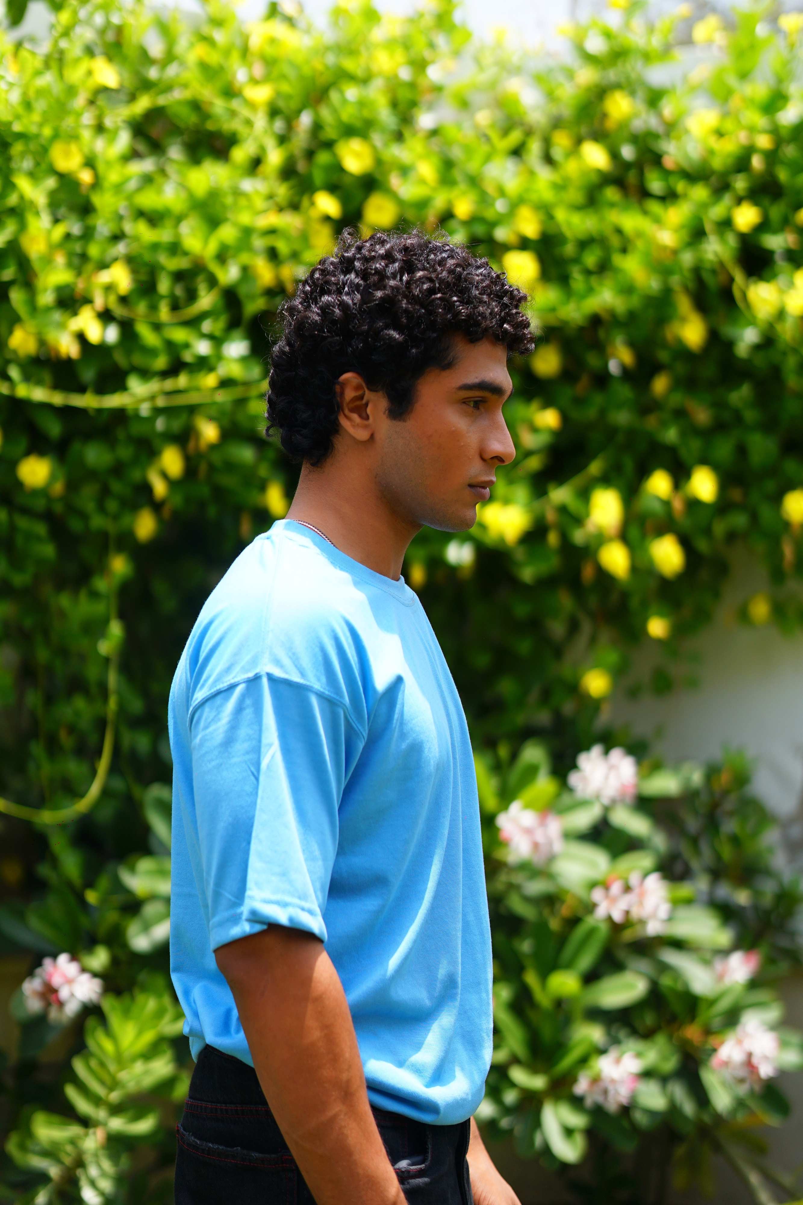 Side profile of male model wearing K2 Cloud sky blue oversized dropshirt for men