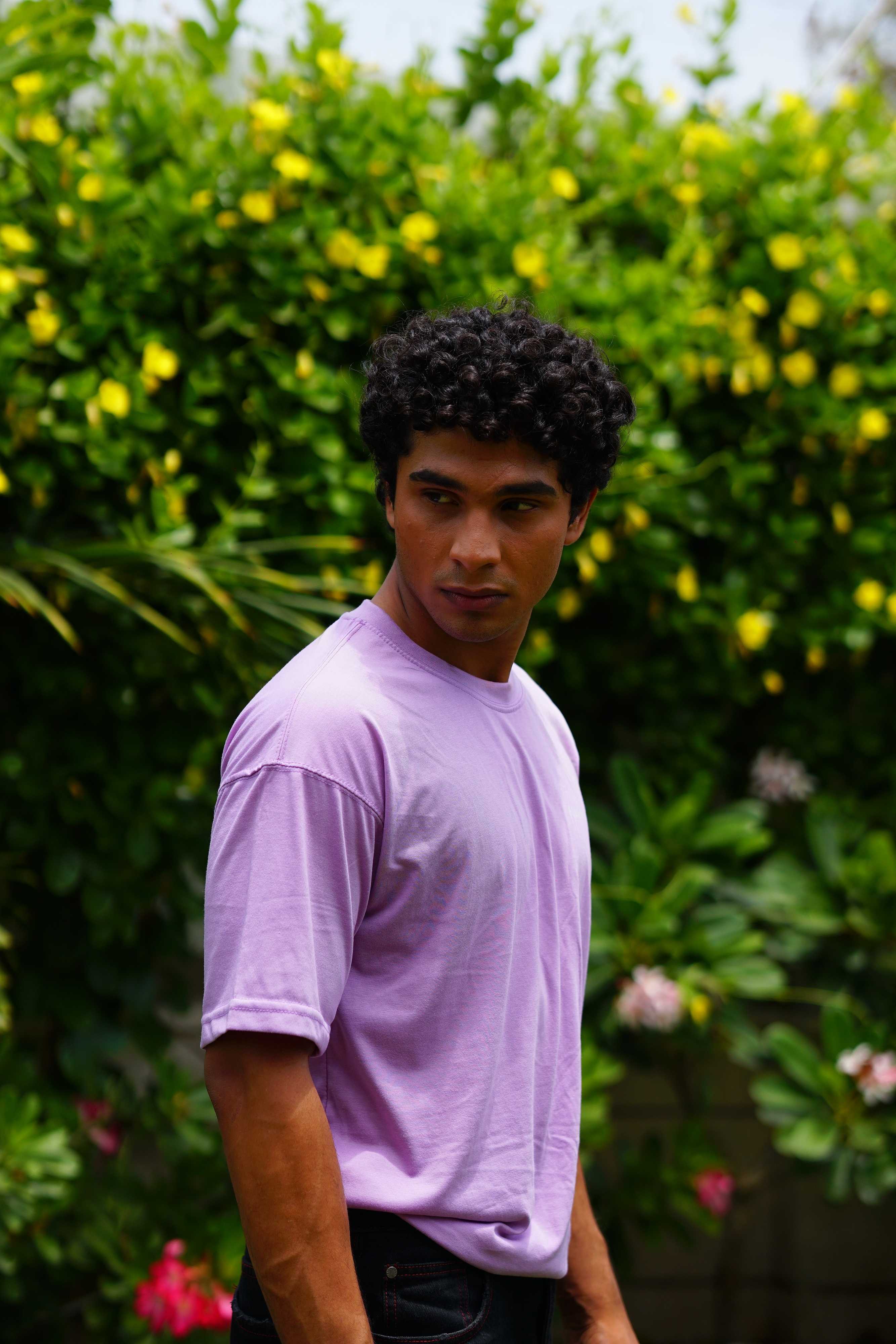 Male model wearing Lahore Lilac Essentials Dropshirt men’s oversized t-shirt outdoors