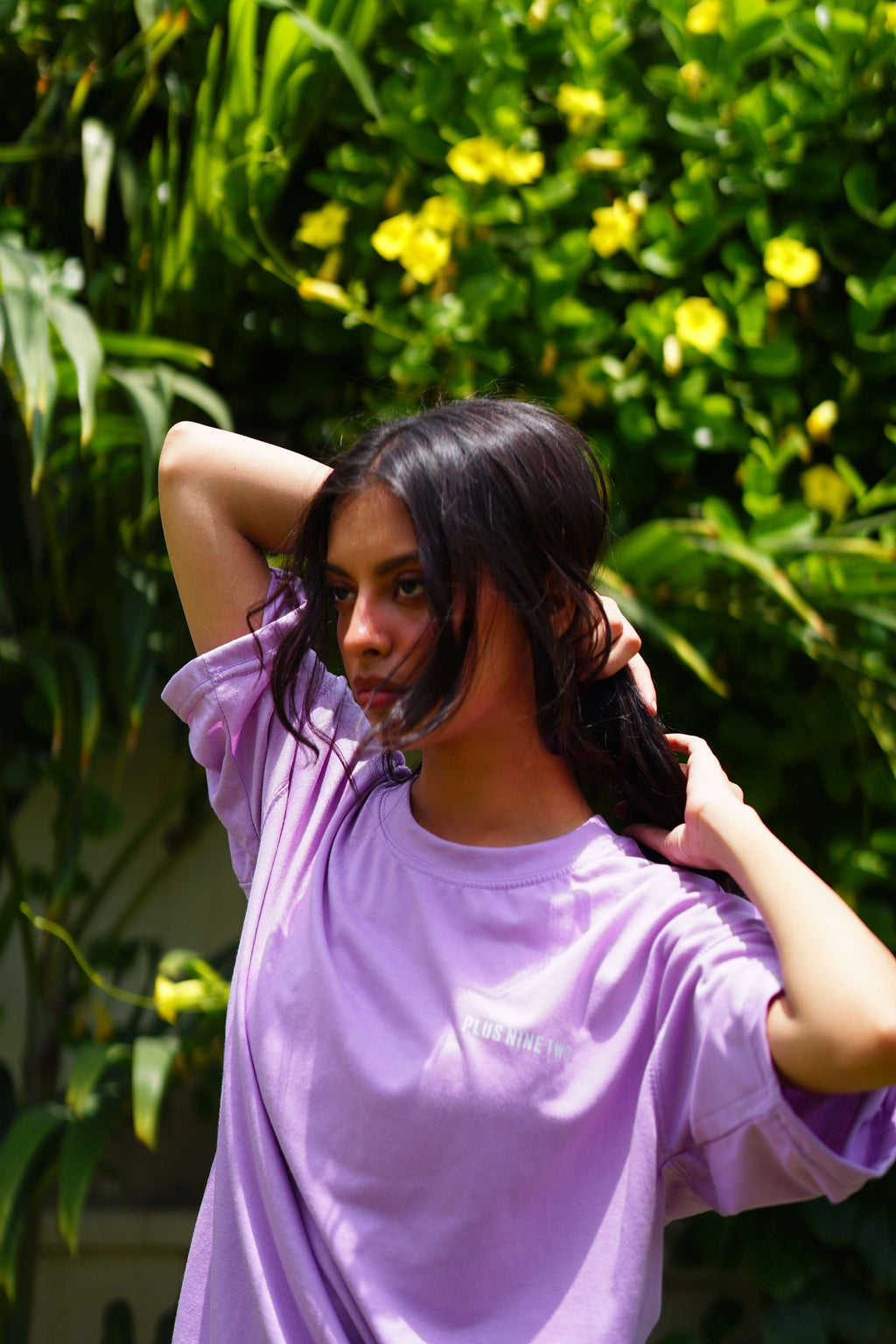 Women’s Lahore Lilac Essentials Dropshirt lifestyle photo in tropical garden