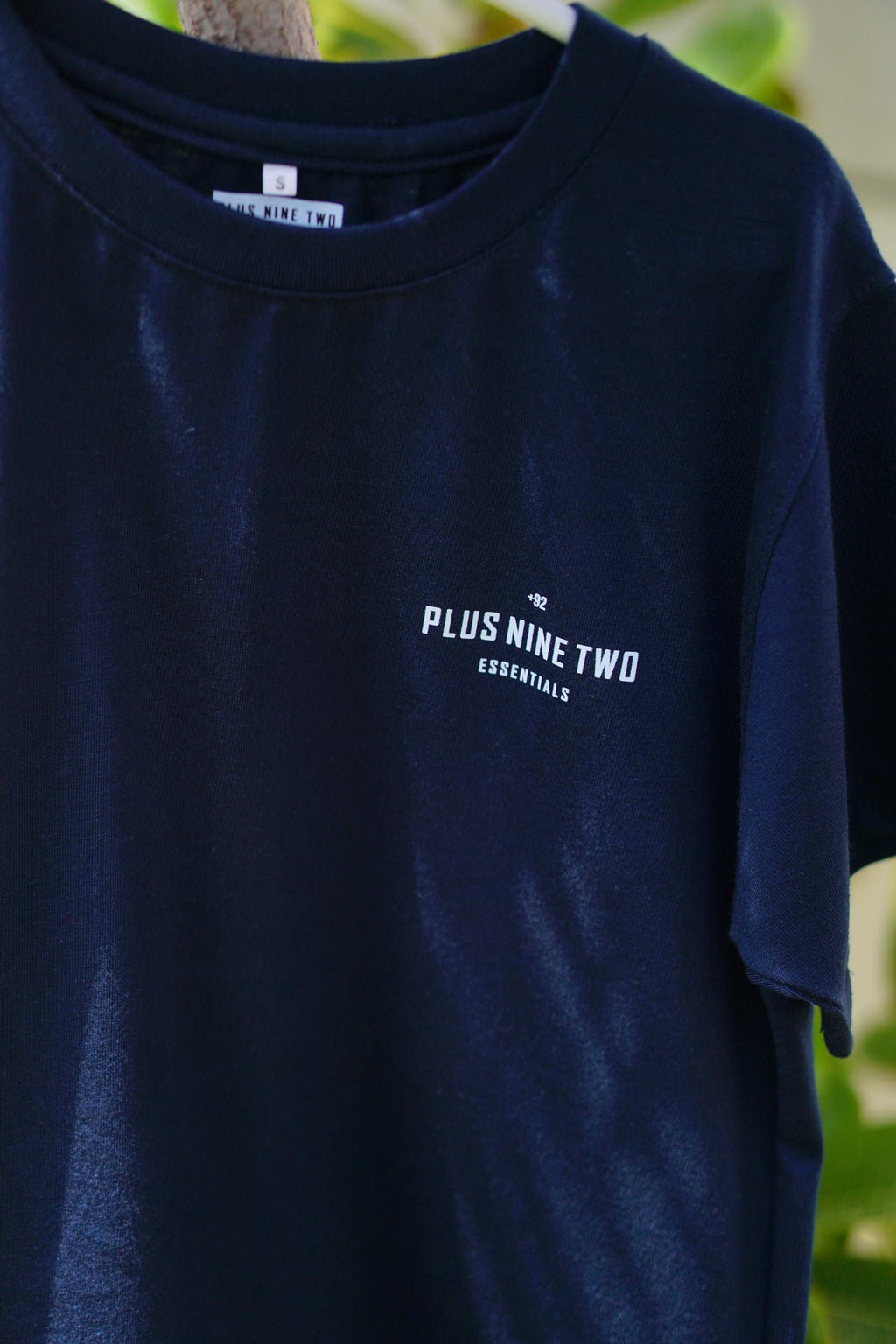 Indus Navy Blue Blend T-Shirt fabric and logo detail on hanger