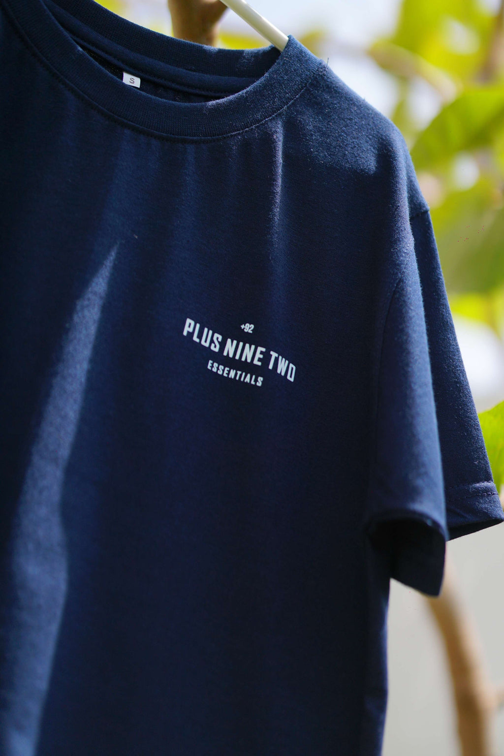 Close-up of Indus Navy Blue Essentials Blend T-Shirt with +92 chest logo