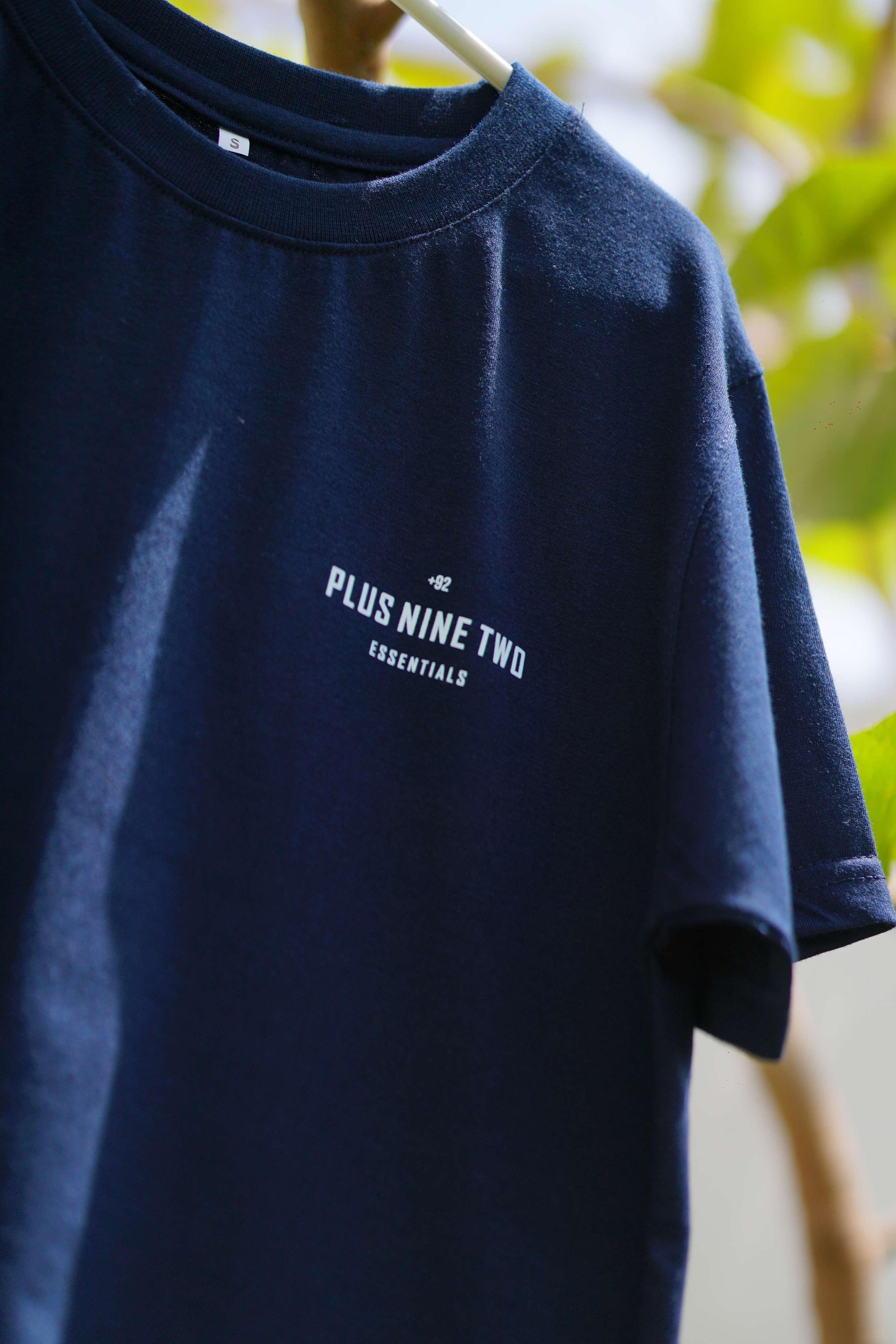 Close-up of Indus Navy Blue Essentials Blend T-Shirt with +92 chest logo