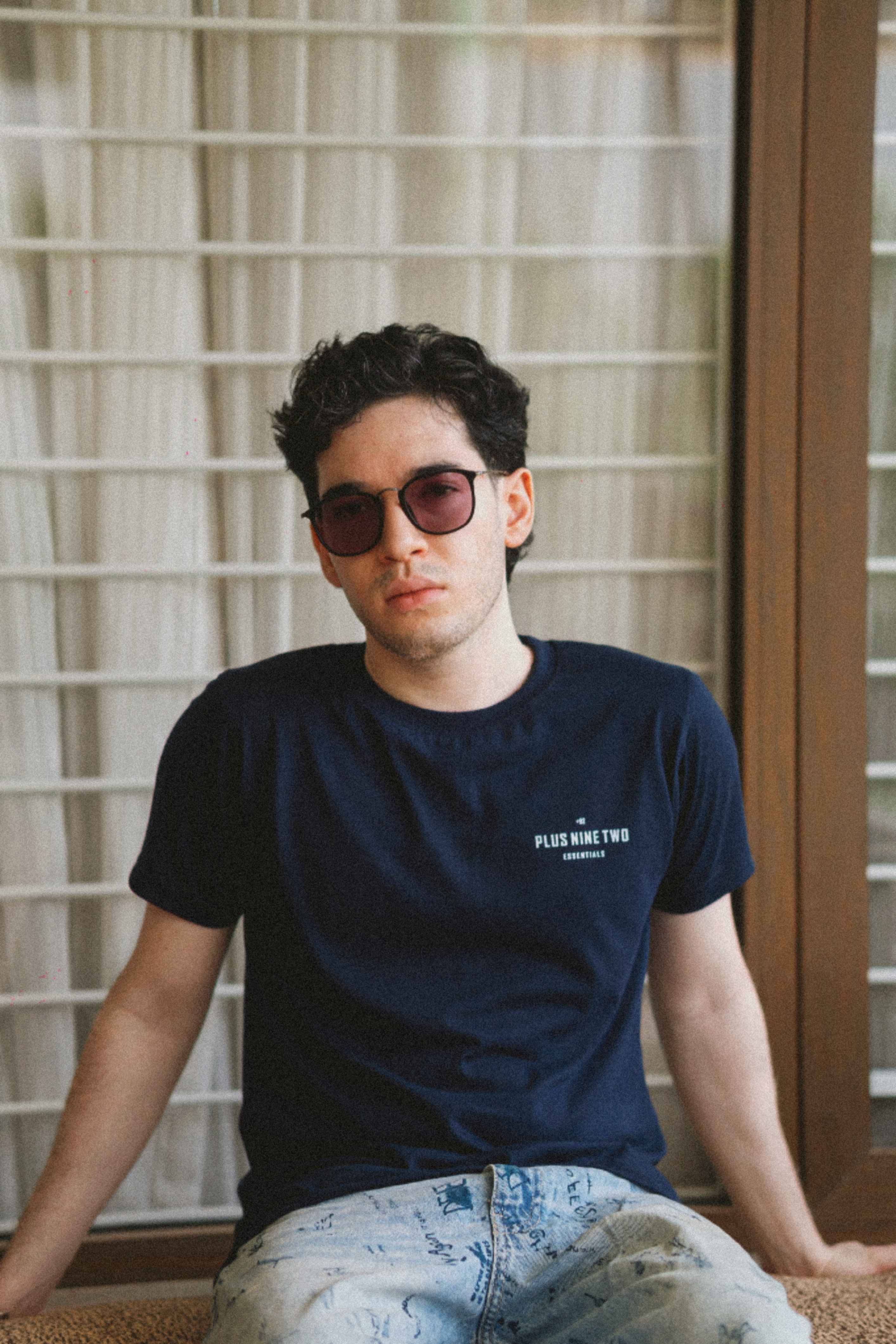 Men’s Indus Navy Blue Essentials Blend T-Shirt seated lifestyle photo