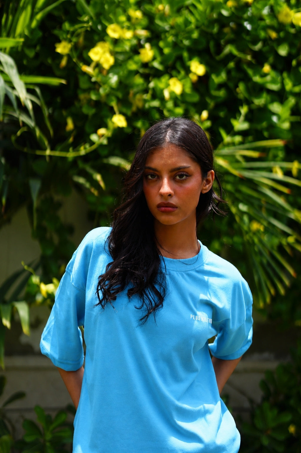Women’s K2 Cloud Sky Blue Essentials Dropshirt front view in garden photoshoot