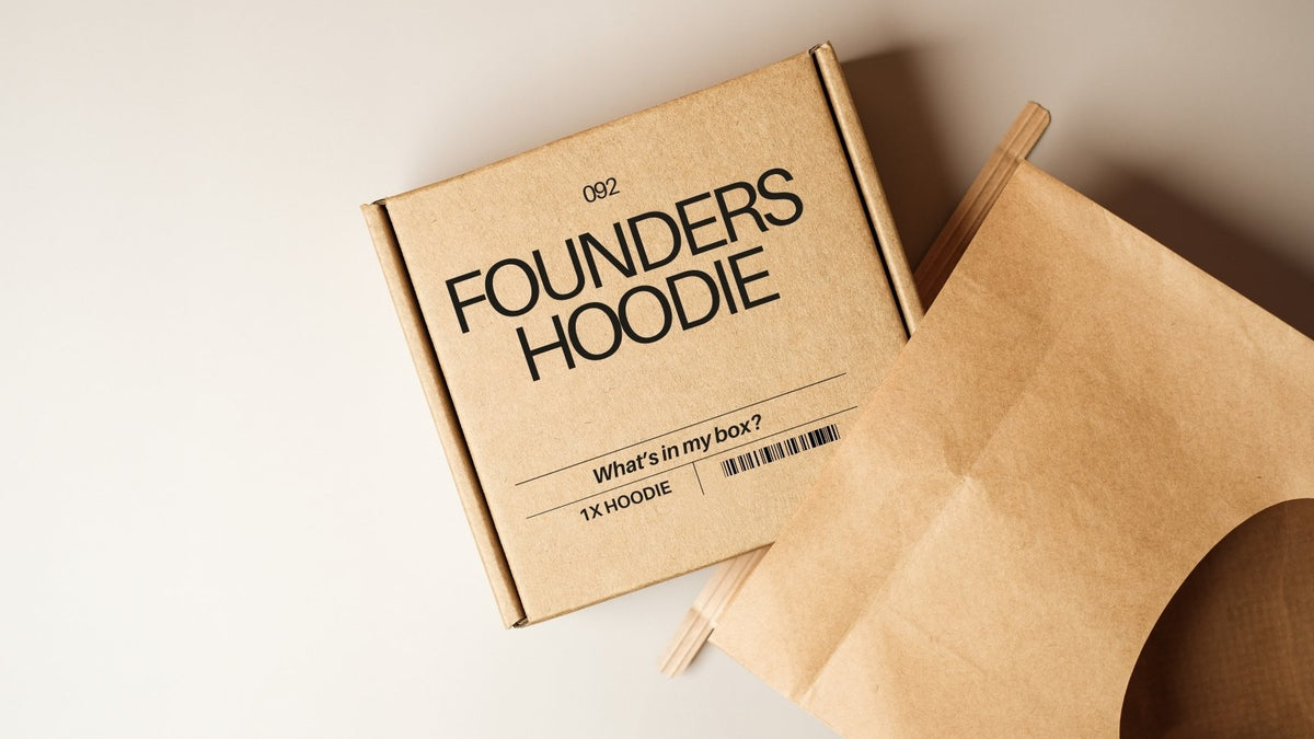 Cardboard box with '092 Founders Hoodie' branding on a light background