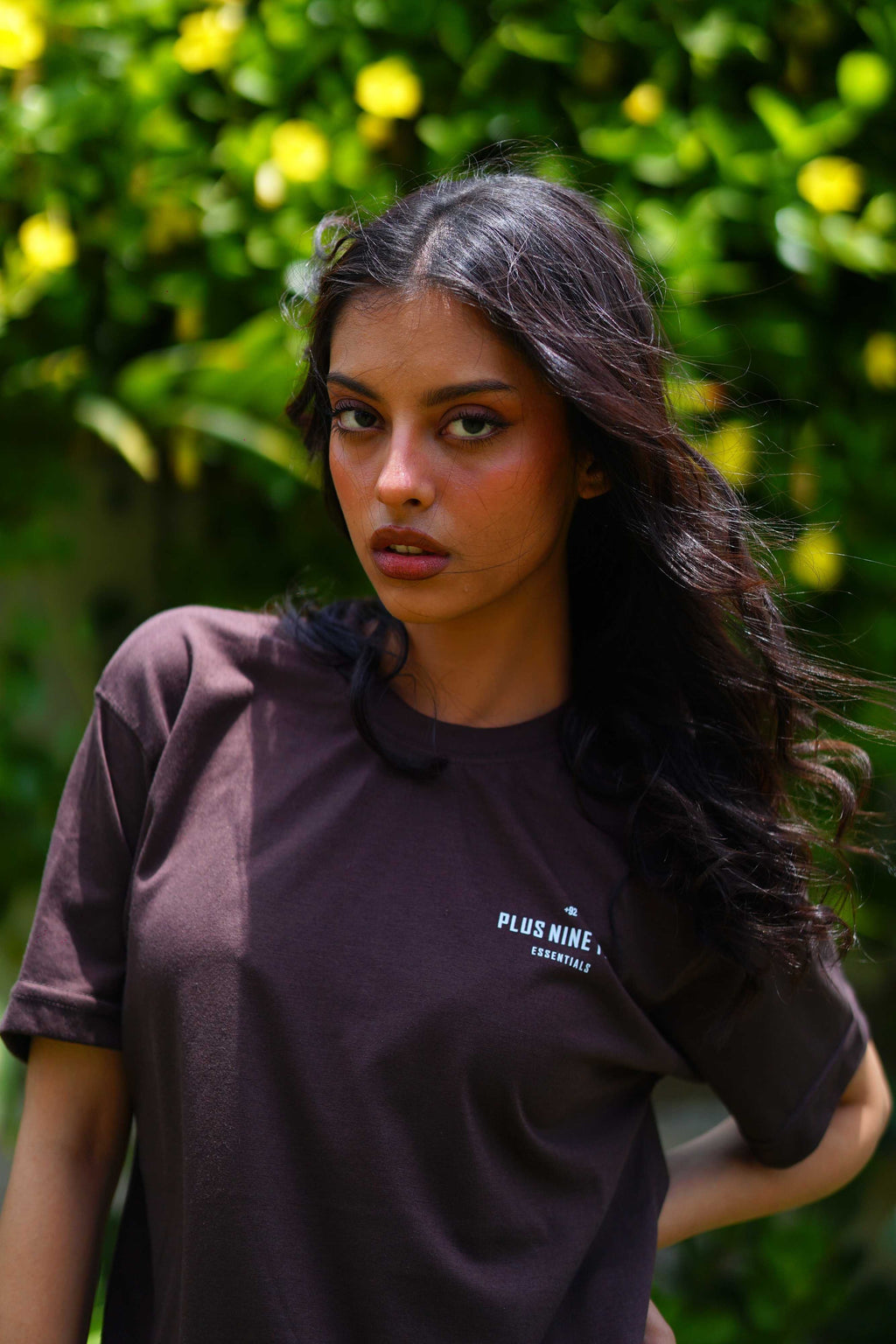 women standing in garden wearing essentials karak brown blend t-shirt