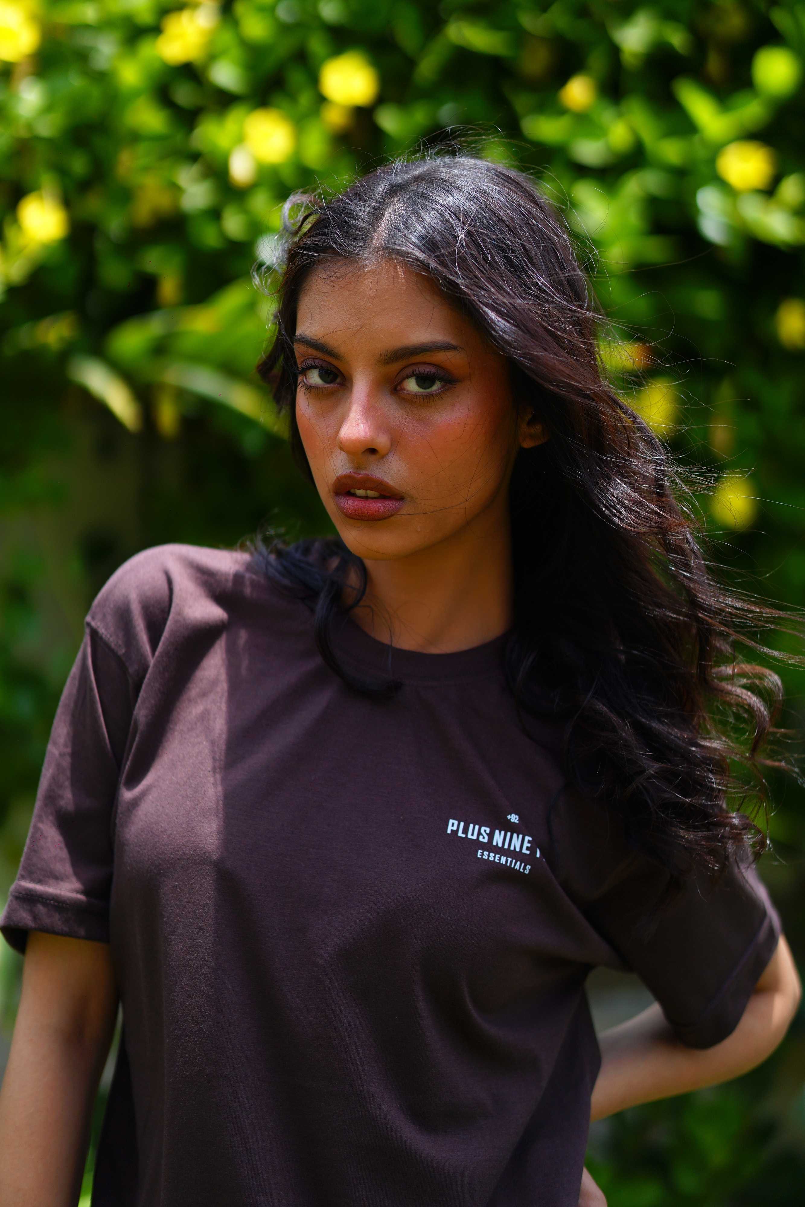 women standing in garden wearing essentials karak brown blend t-shirt