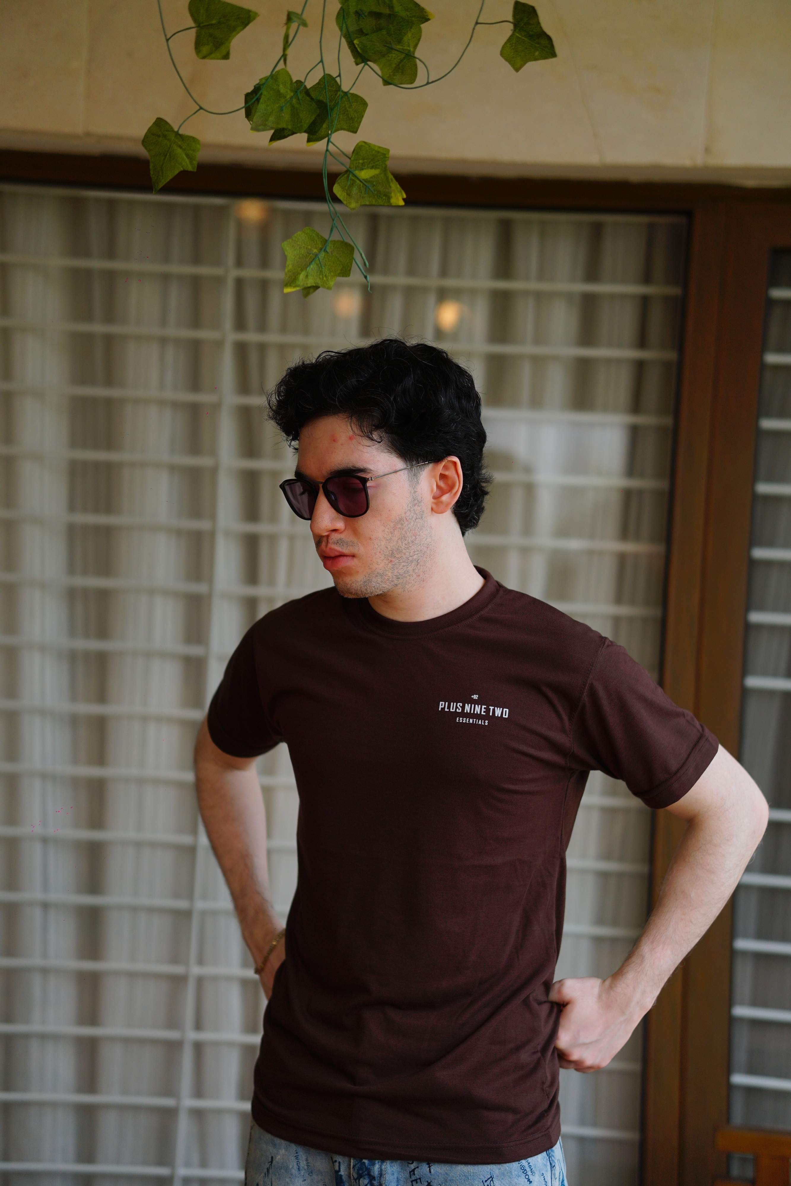 Man standing, wearing karak brown men blend t-shirt with pocket print visible