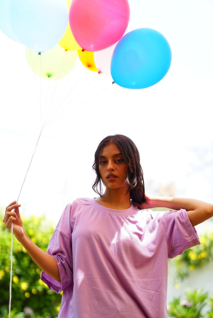 Female model wearing Lahore Lilac Essentials Dropshirt women’s oversized t-shirt with colorful balloons