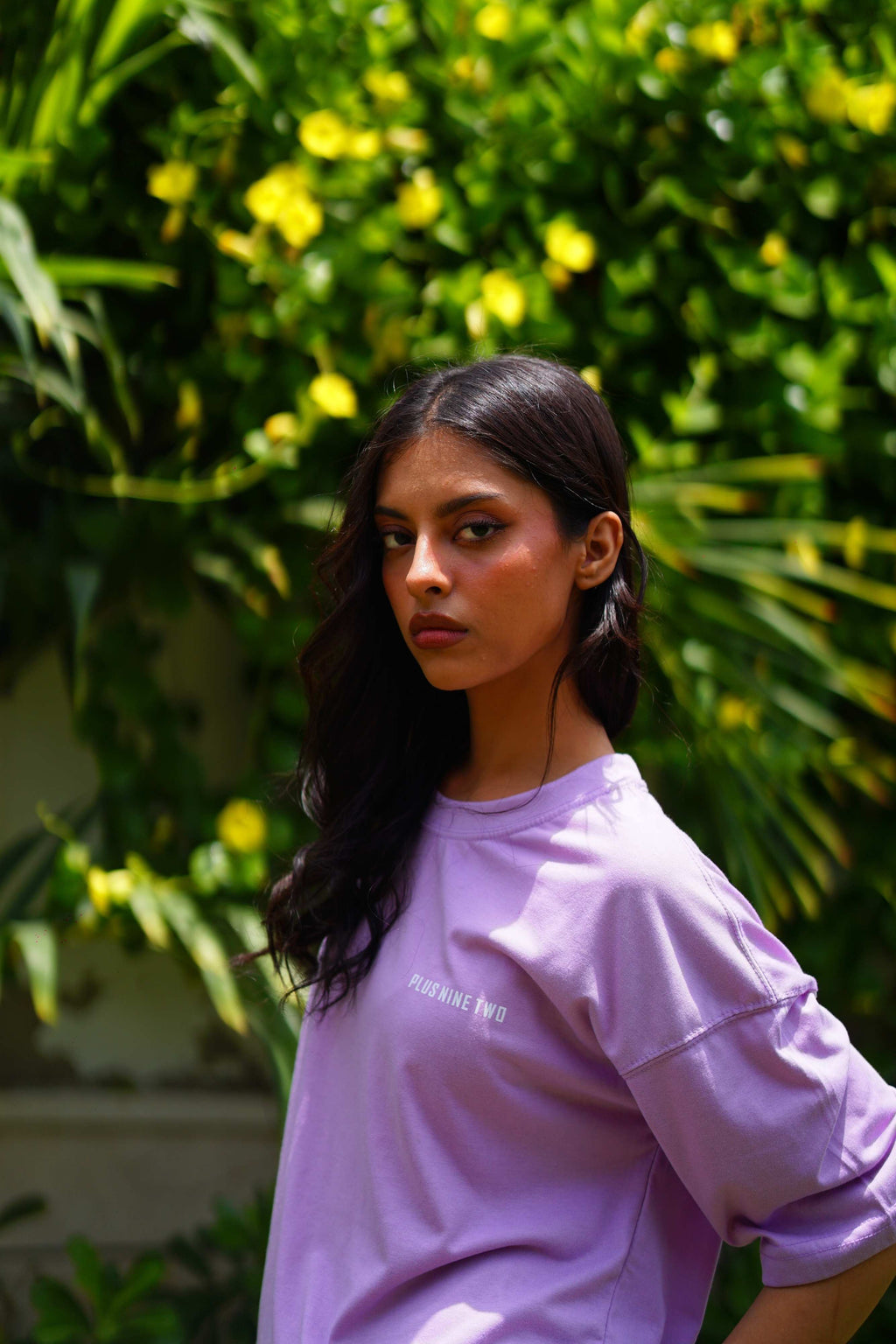 Female model wearing Lahore Lilac oversized dropshirt for women by +92 Clothing