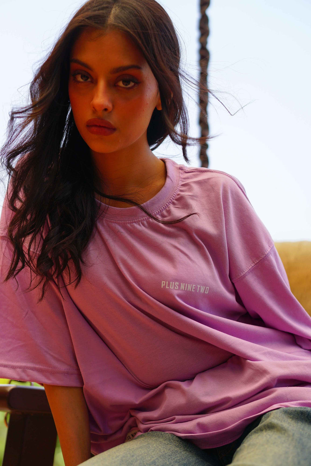 Female model in Lahore Lilac Essentials Dropshirt women’s oversized t-shirt on swing